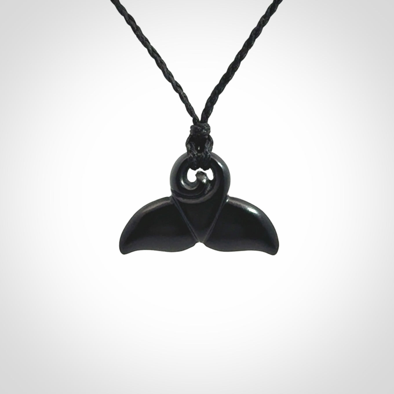 Hand carved Australian Black Jade whale tail pendant. Small whale tail necklace with adjustable cord.