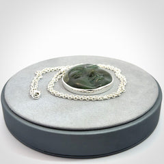 Hand made New Zealand Jade moon face necklace with Sterling Silver. Made by NZ Pacific and sale online only. Delivered with sterling silver chain and packaged in a woven kete pouch.