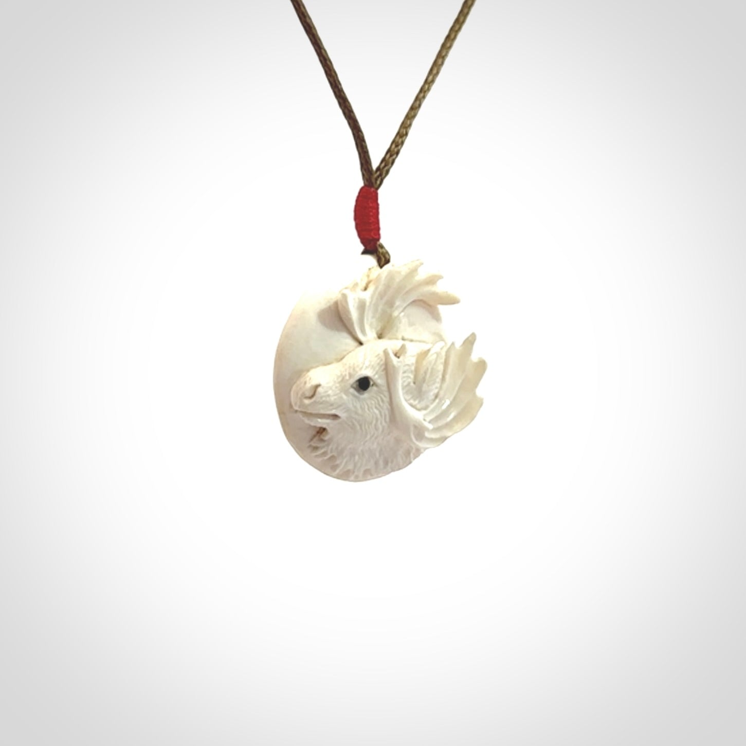 Hand carved Moose pendant in Woolly Mammoth Tusk