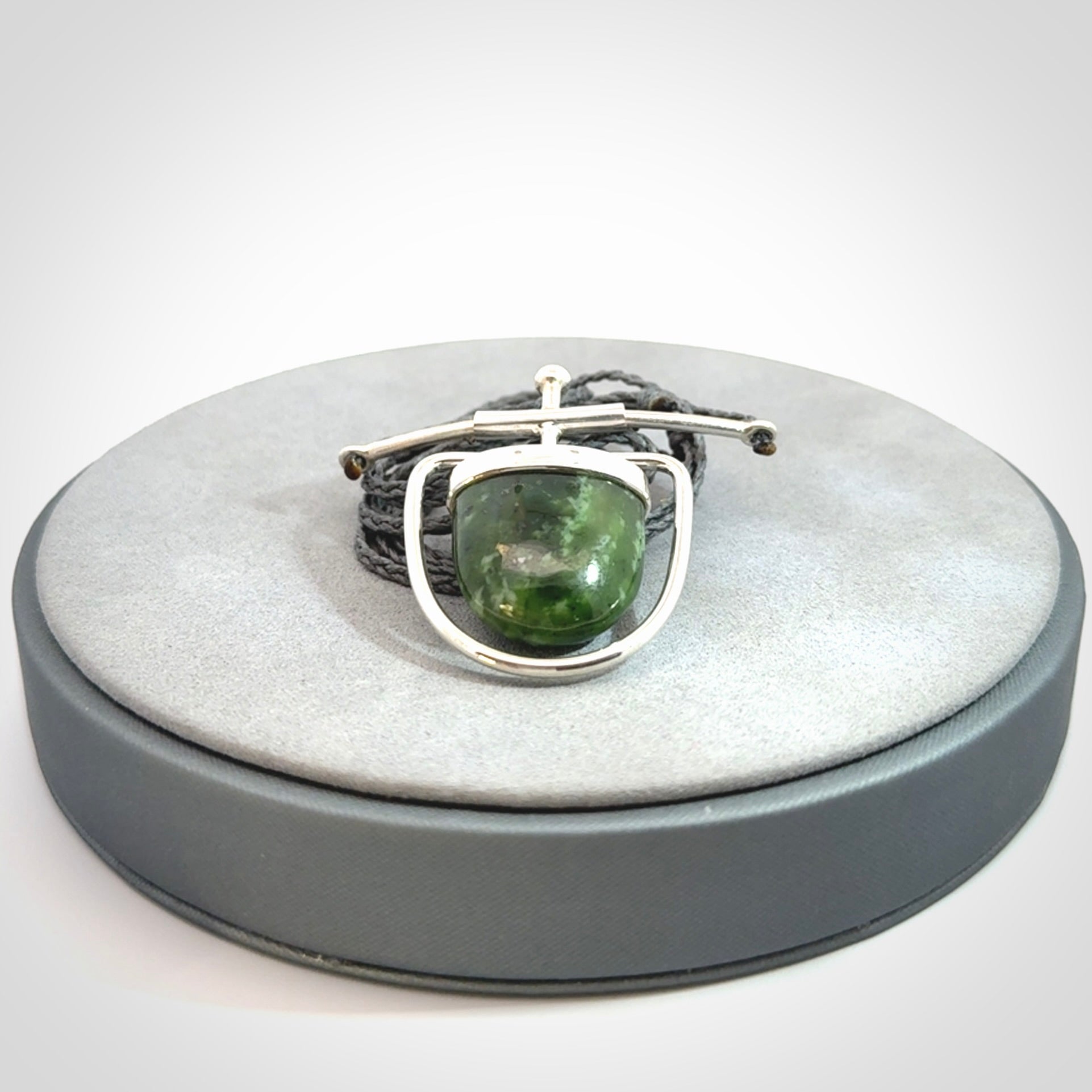 Hand crafted contemporary green jade and sterling silver drop necklace. This necklace is provided with a adjustable cord. Contemporary green jade drop necklace with sterling silver.
