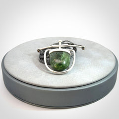 Hand crafted contemporary green jade and sterling silver drop necklace. This necklace is provided with a adjustable cord. Contemporary green jade drop necklace with sterling silver.