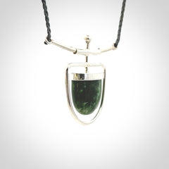Hand crafted contemporary green jade and sterling silver drop necklace. This necklace is provided with a adjustable cord. Contemporary green jade drop necklace with sterling silver.