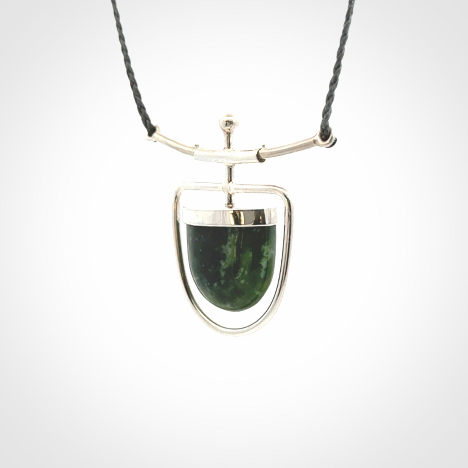 Hand crafted contemporary green jade and sterling silver drop necklace. This necklace is provided with a adjustable cord. Contemporary green jade drop necklace with sterling silver.