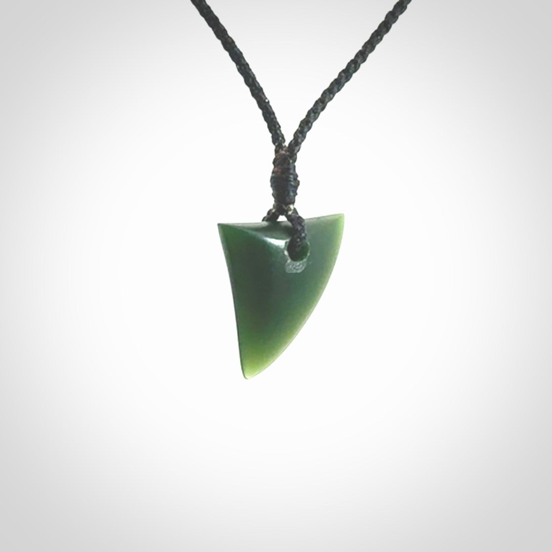 Hand carved pounamu niho, drop pendant. Jade necklace hand made in New Zealand.