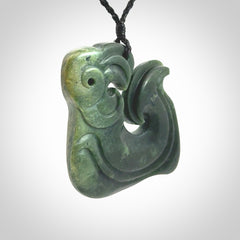 A beautiful hand carved, New Zealand Jade Matau, hook pendant.