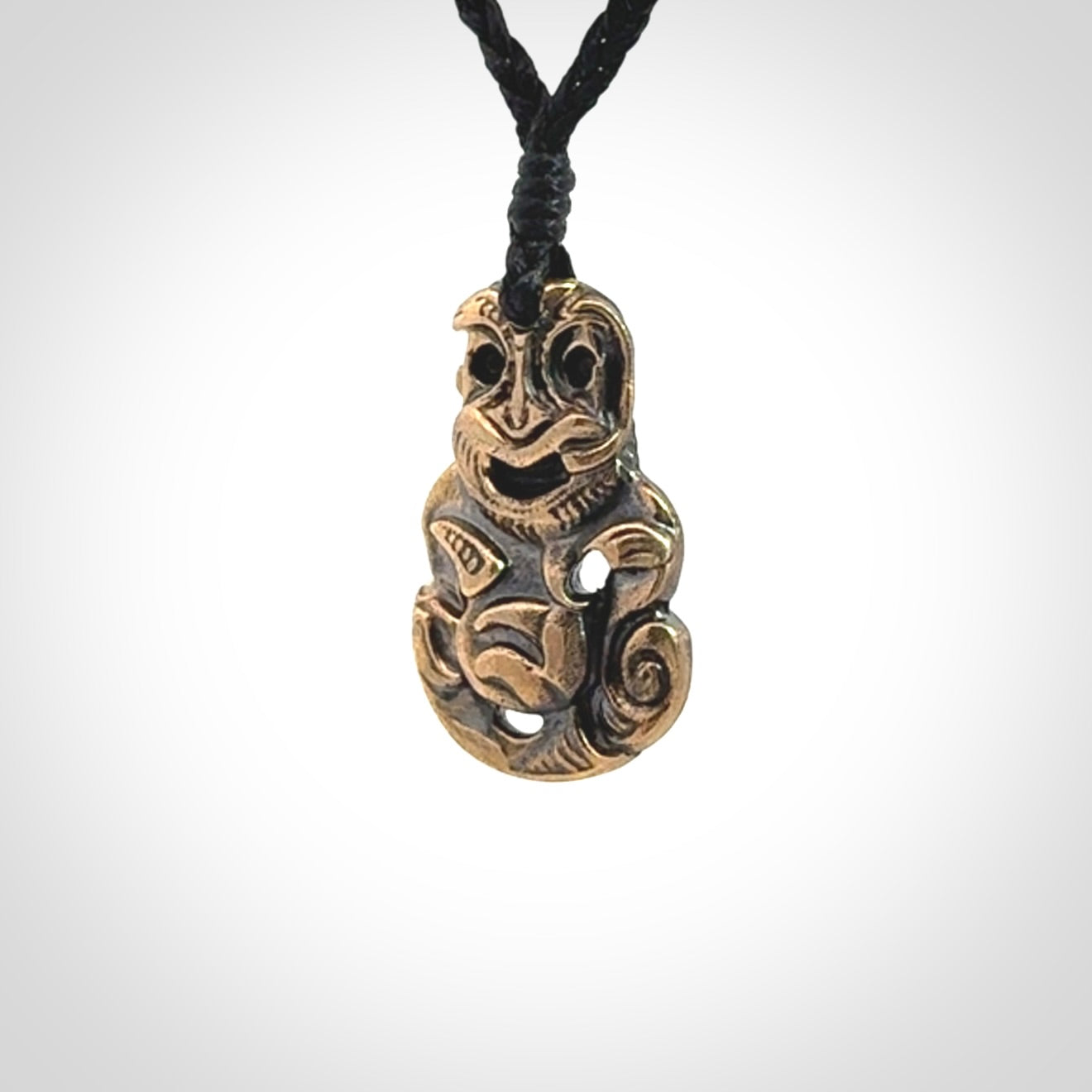 A beautiful hand made, bronze tiki pendant.