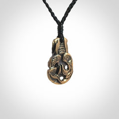 A beautiful hand made, bronze tiki pendant.