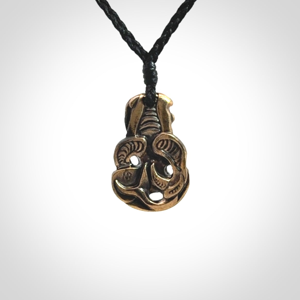 A beautiful hand made, bronze tiki pendant.