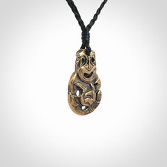 A beautiful hand made, bronze tiki pendant.