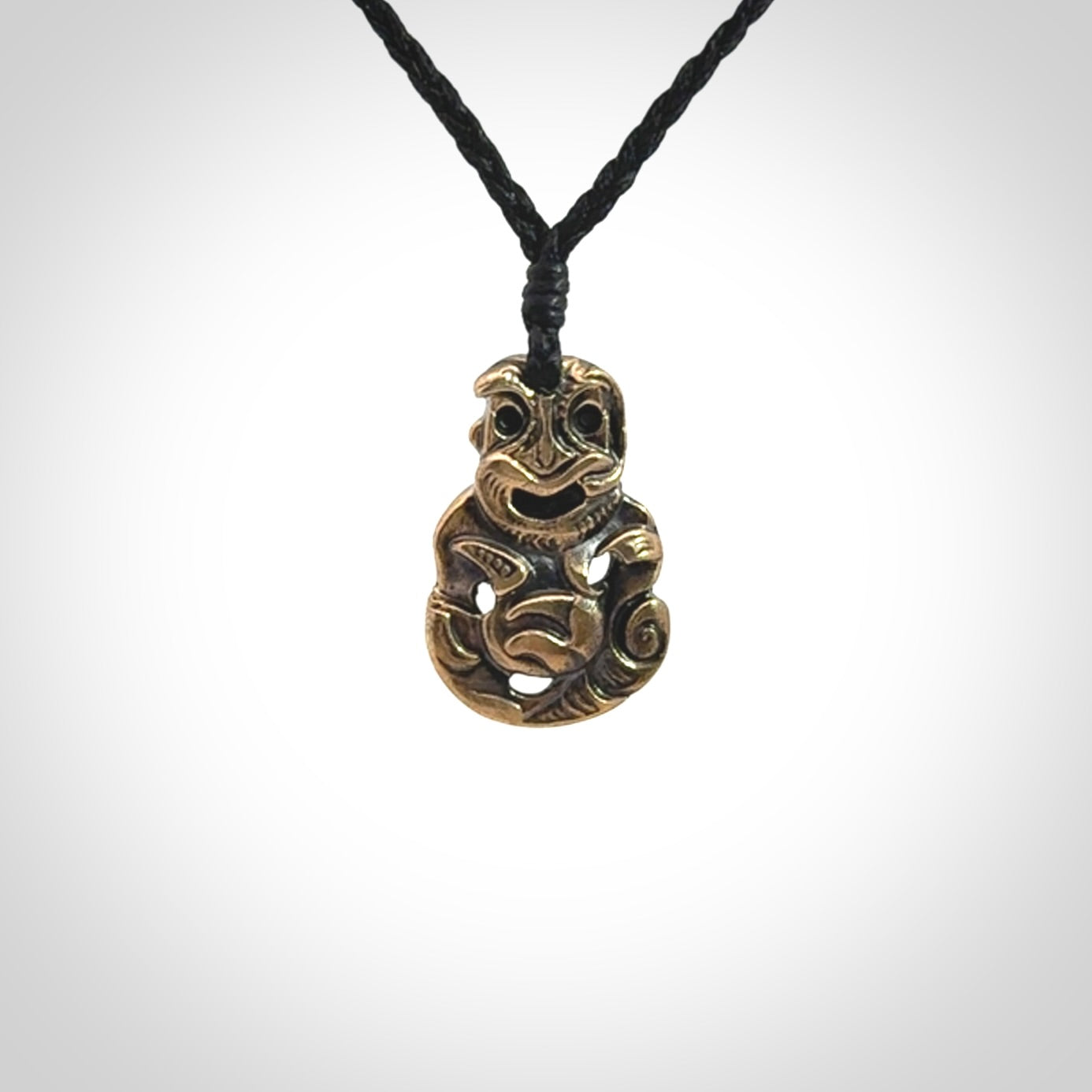A beautiful hand made, bronze tiki pendant.