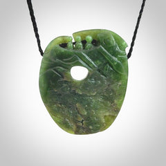 A beautiful hand carved, New Zealand Jade waka pendant.