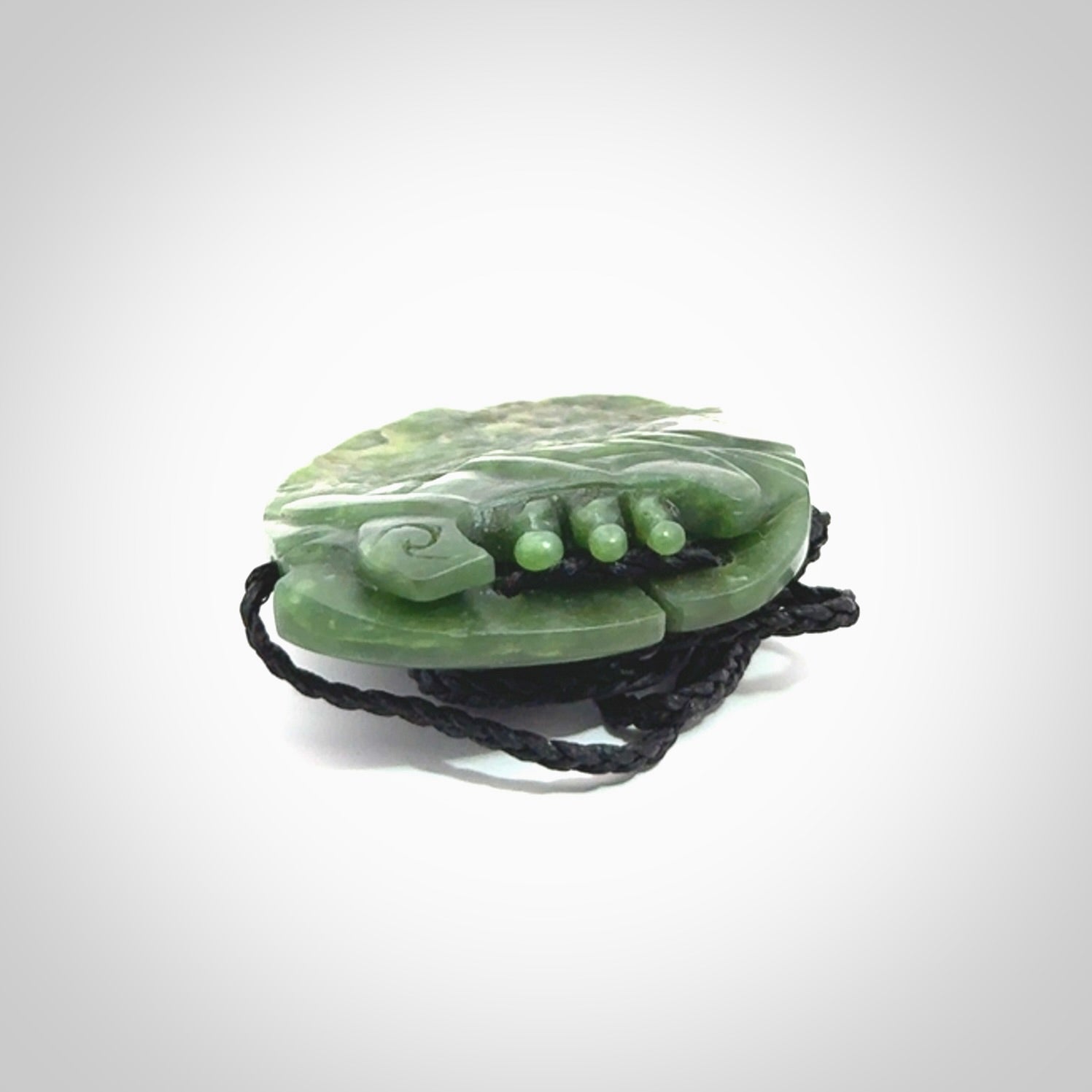 A beautiful hand carved, New Zealand Jade waka pendant.