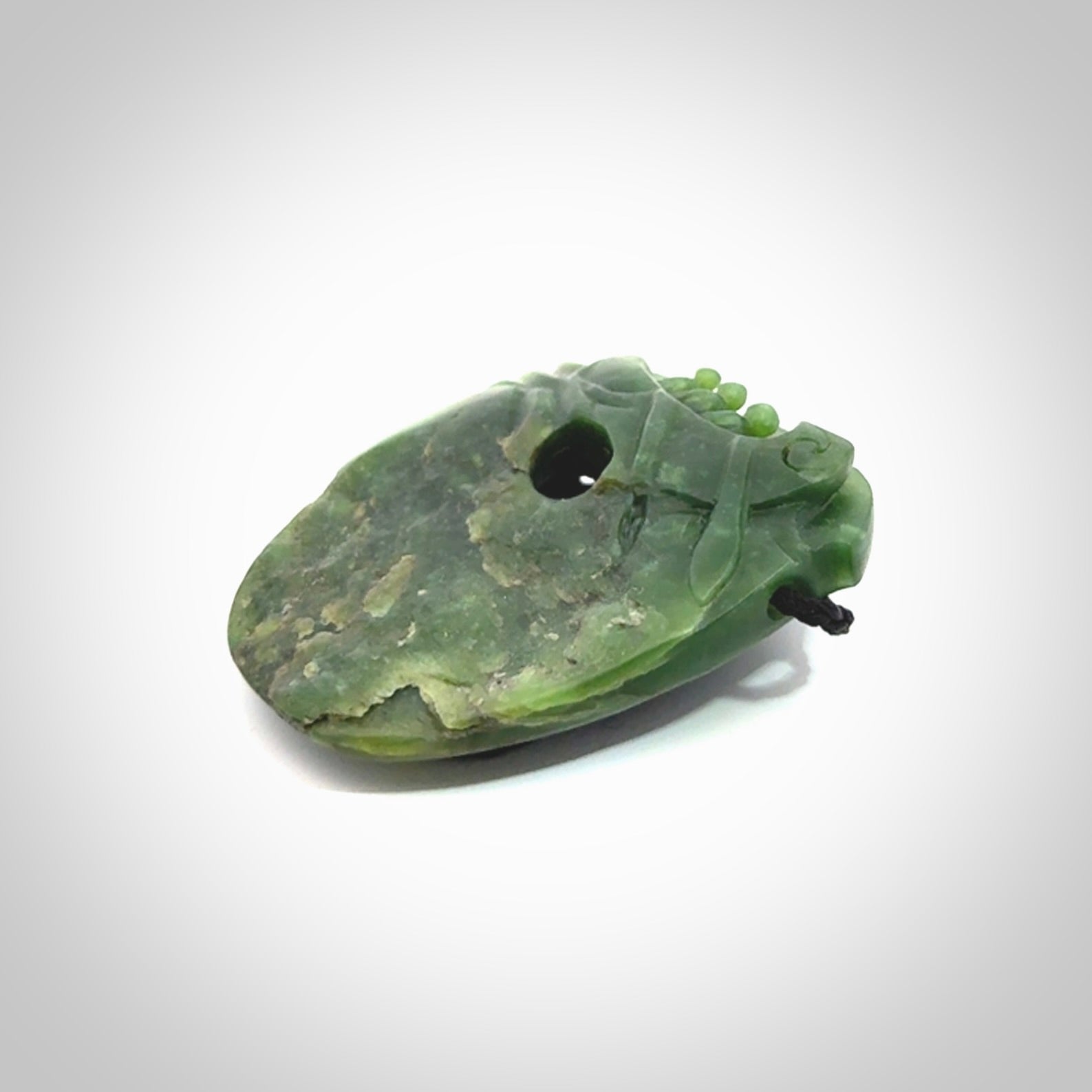 A beautiful hand carved, New Zealand Jade waka pendant.