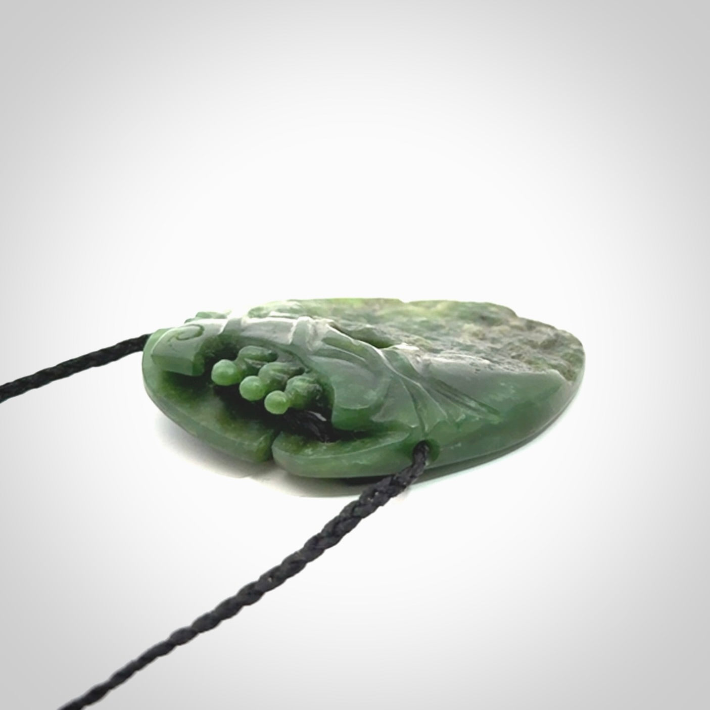 A beautiful hand carved, New Zealand Jade waka pendant.