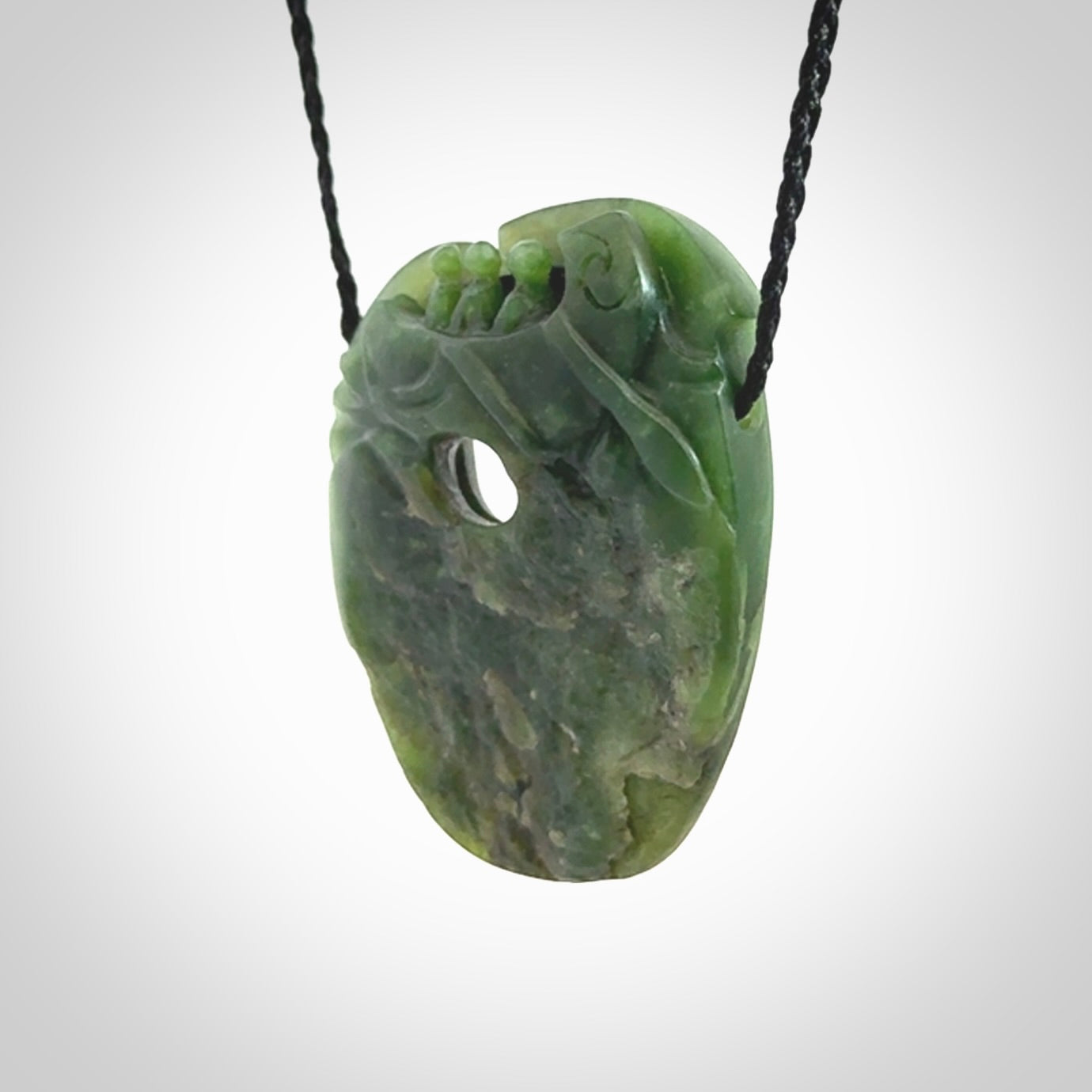 A beautiful hand carved, New Zealand Jade waka pendant.