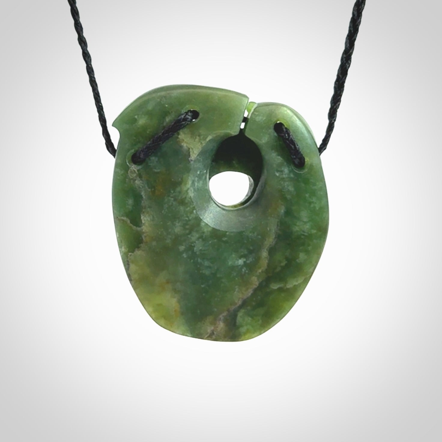 A beautiful hand carved, New Zealand Jade waka pendant.