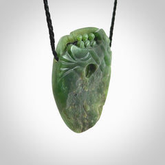 A beautiful hand carved, New Zealand Jade waka pendant.