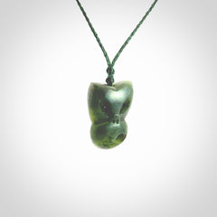 Hand carved New Zealand Jade Pounamu Wheku face pendant. Carved from New Zealand Jade by NZ Pacific. Hand crafted Jade jewellery for sale online. Pacific carving pendant, striking and unique delivered to you with Express Courier at no extra cost.