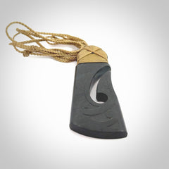 Hand made large New Zealand Argillite toki with hook pendant. Hand carved in New Zealand by Rueben Tipene. Hand made jewellery. Unique large Argillite Stone Toki and hook pendant with adjustable cord. Free shipping worldwide.