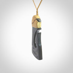 Hand made large New Zealand Argillite toki with hook pendant. Hand carved in New Zealand by Rueben Tipene. Hand made jewellery. Unique large Argillite Stone Toki and hook pendant with adjustable cord. Free shipping worldwide.