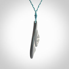 Hand carved New Zealand Argillite Stone whale tail pendant by Rueben Tipene. Hand made art to wear for lovers of the ocean. Delivered with express courier and delivered to you on an adjustable cord.
