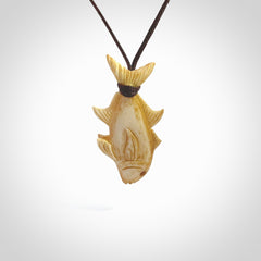 Hand carved stained bone fish pendant. Hand made stained bone fish necklace. Fish themed jewellery. Ocean themed pendant. Bone fish necklace provided with adjustable cord and free delivery.