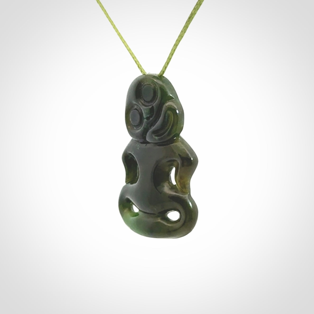 This pendant is a small jade tiki pendant. The carving shows wonderful detail on the front while the back is beautifully rounded. These are carved in Columbian Jade. The cord is adjustable in length. Provided in a woven kete pouch and shipped worldwide.