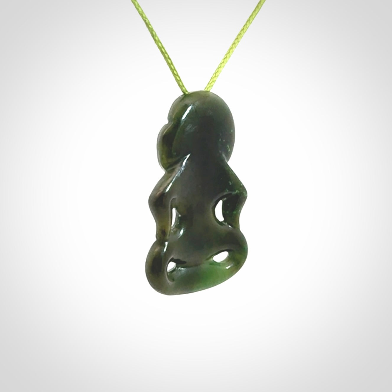 This pendant is a small jade tiki pendant. The carving shows wonderful detail on the front while the back is beautifully rounded. These are carved in Columbian Jade. The cord is adjustable in length. Provided in a woven kete pouch and shipped worldwide.