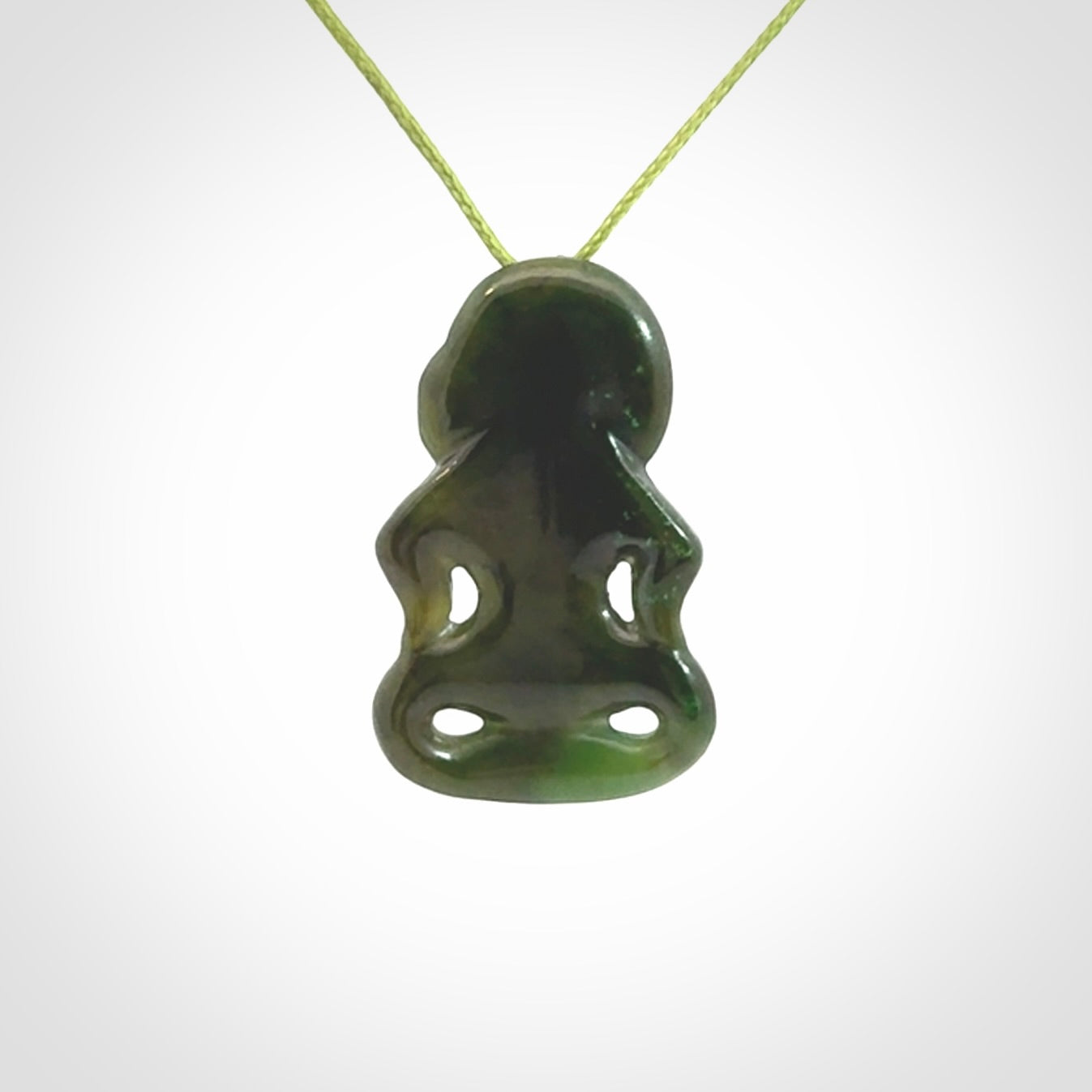 This pendant is a small jade tiki pendant. The carving shows wonderful detail on the front while the back is beautifully rounded. These are carved in Columbian Jade. The cord is adjustable in length. Provided in a woven kete pouch and shipped worldwide.