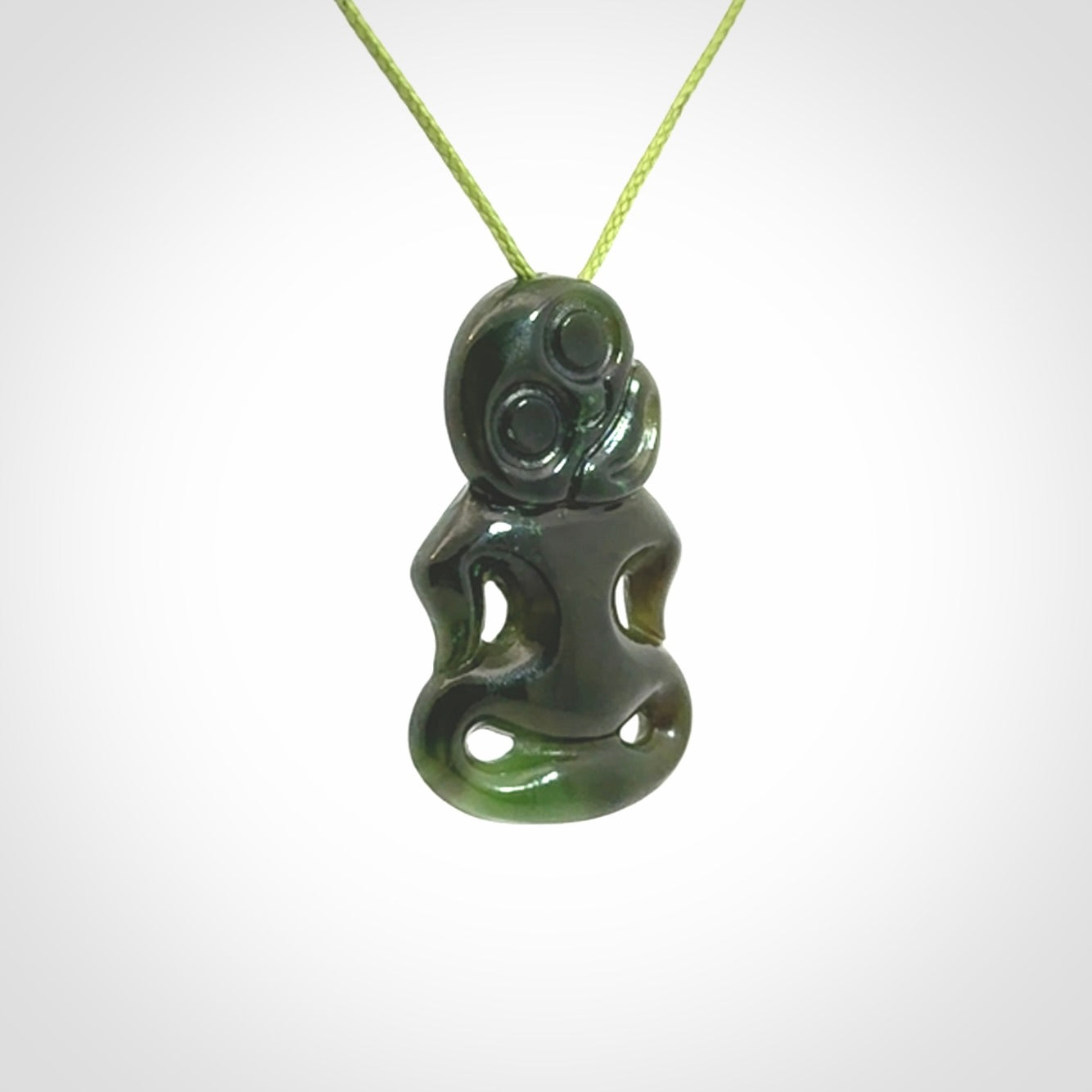 This pendant is a small jade tiki pendant. The carving shows wonderful detail on the front while the back is beautifully rounded. These are carved in Columbian Jade. The cord is adjustable in length. Provided in a woven kete pouch and shipped worldwide.