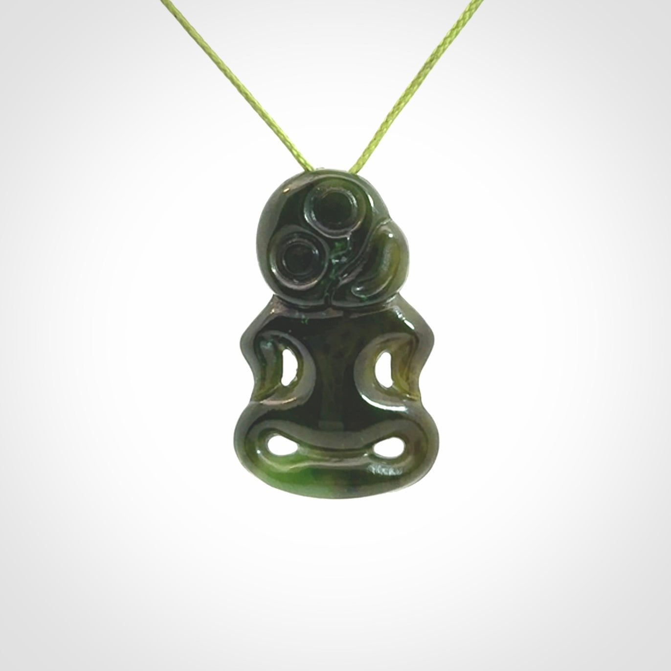 This pendant is a small jade tiki pendant. The carving shows wonderful detail on the front while the back is beautifully rounded. These are carved in Columbian Jade. The cord is adjustable in length. Provided in a woven kete pouch and shipped worldwide.