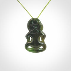 This pendant is a small jade tiki pendant. The carving shows wonderful detail on the front while the back is beautifully rounded. These are carved in Columbian Jade. The cord is adjustable in length. Provided in a woven kete pouch and shipped worldwide.