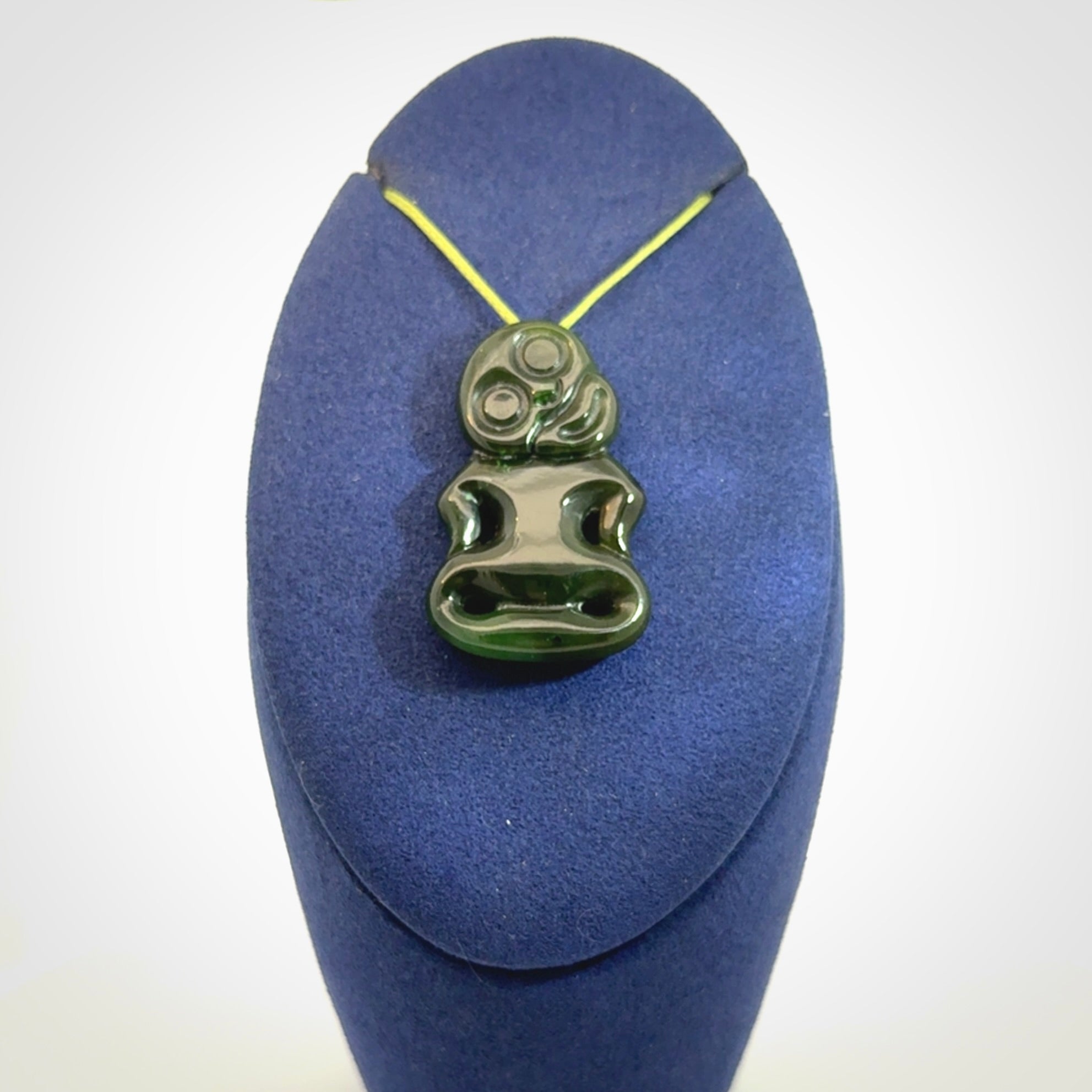 This pendant is a small jade tiki pendant. The carving shows wonderful detail on the front while the back is beautifully rounded. These are carved in Columbian Jade. The cord is adjustable in length. Provided in a woven kete pouch and shipped worldwide.
