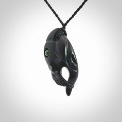 This is a hand carved Black Jade bird head pendant with New Zealand Jade insert. This is a smaller sized necklace and is provided with an adjustable black cord.