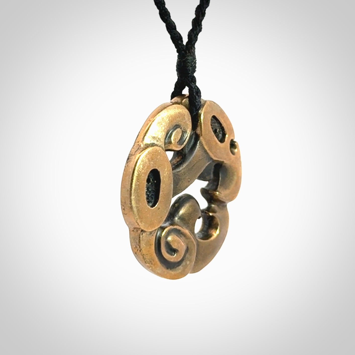 A beautiful hand made, bronze manaia pendant.