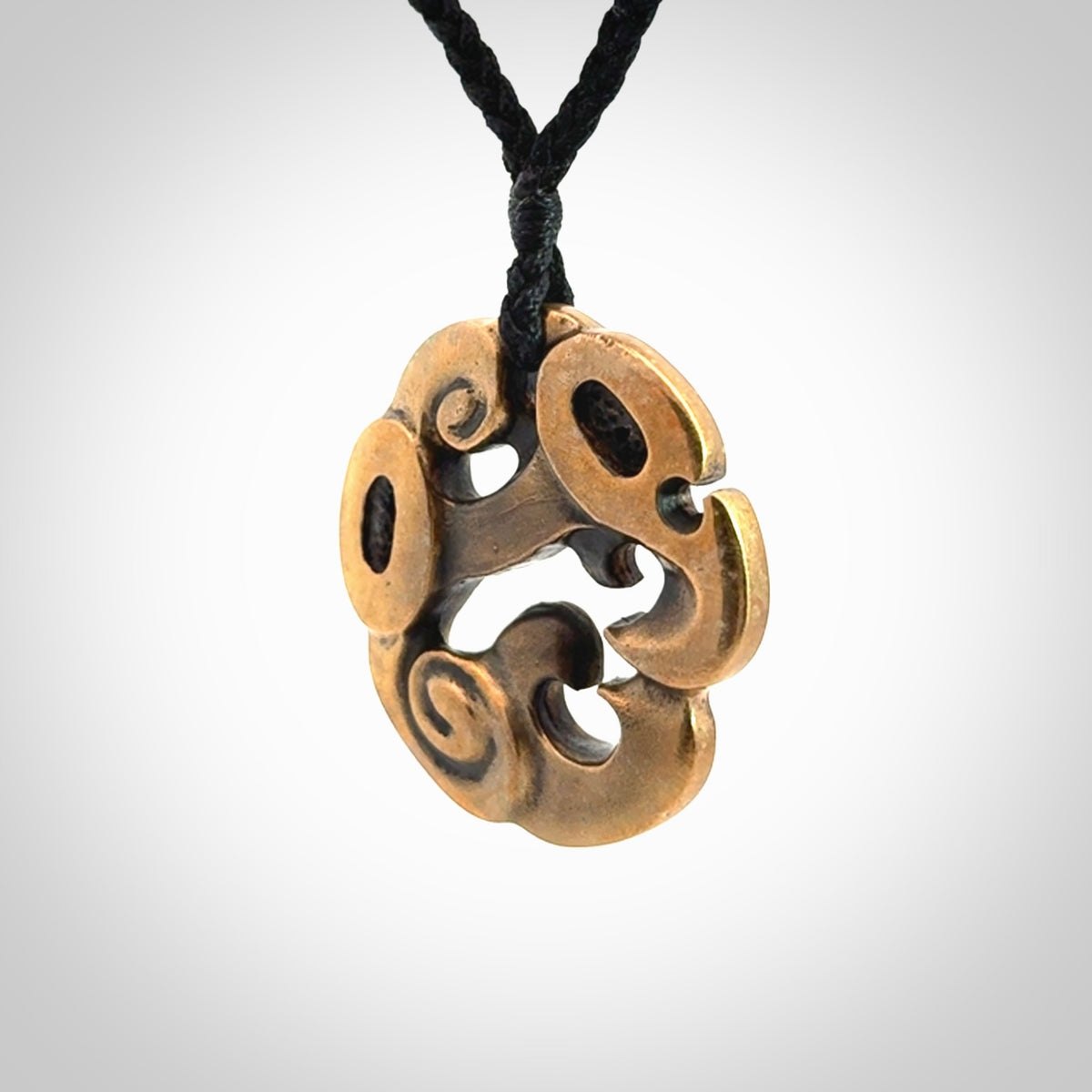 A beautiful hand made, bronze manaia pendant.