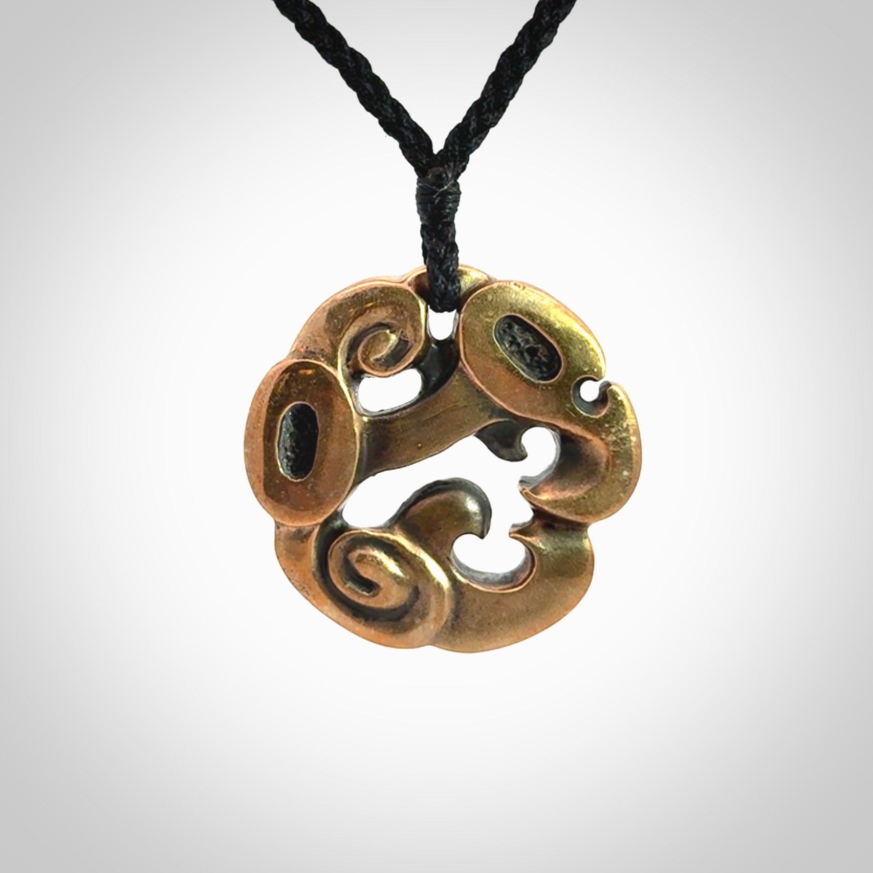 A beautiful hand made, bronze manaia pendant.