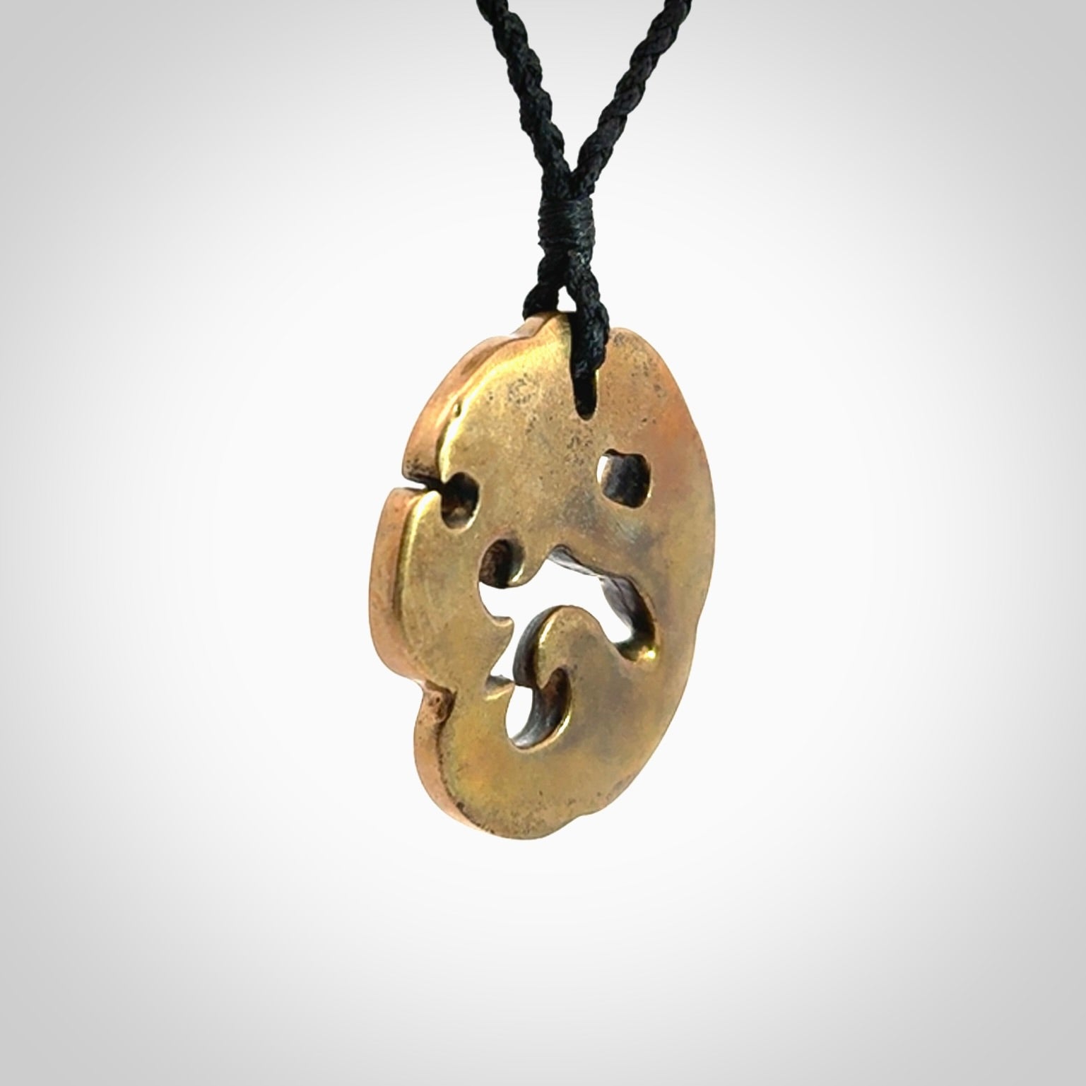 A beautiful hand made, bronze manaia pendant.