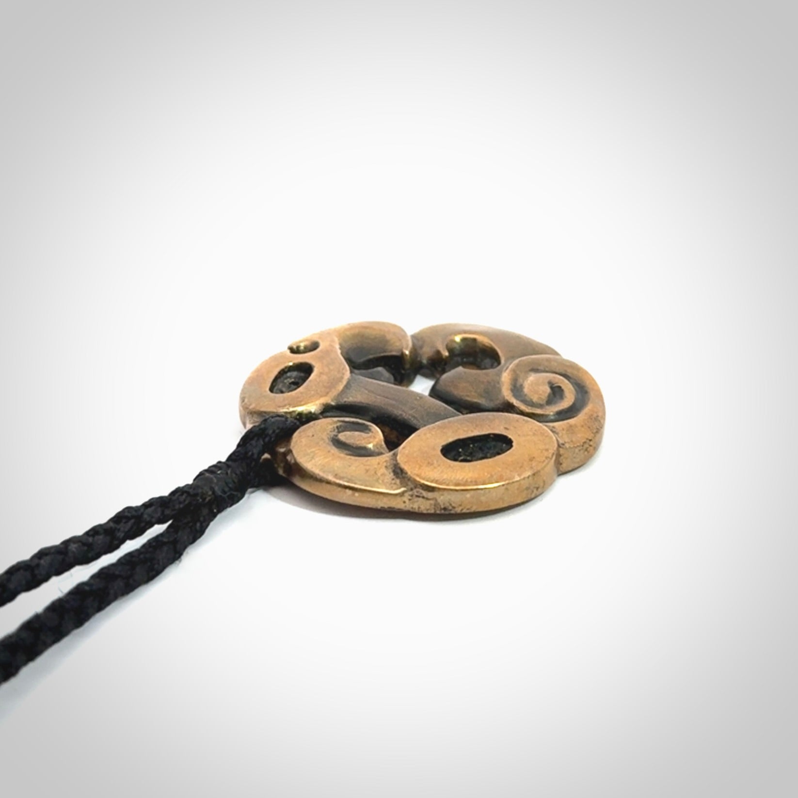 A beautiful hand made, bronze manaia pendant.