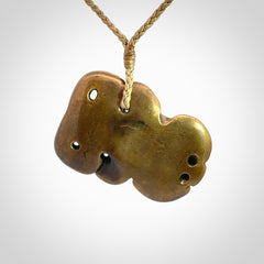 A beautiful hand made, bronze tiki pendant.