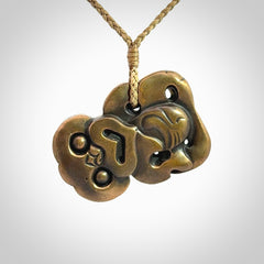 A beautiful hand made, bronze tiki pendant.