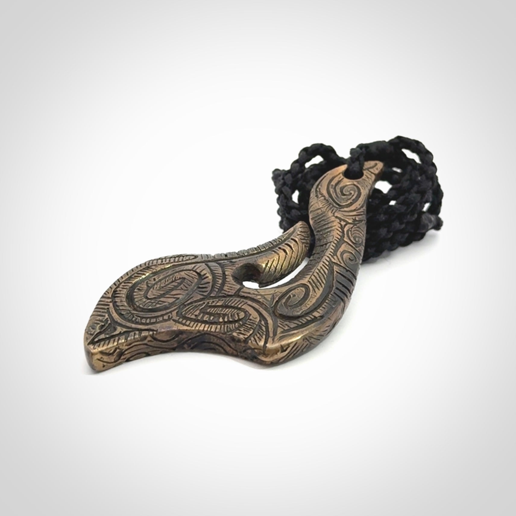 A beautiful hand made, bronze matau pendant.