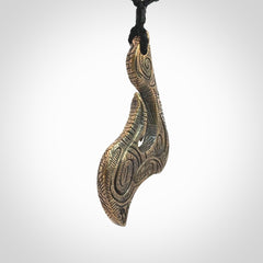 A beautiful hand made, bronze matau pendant.