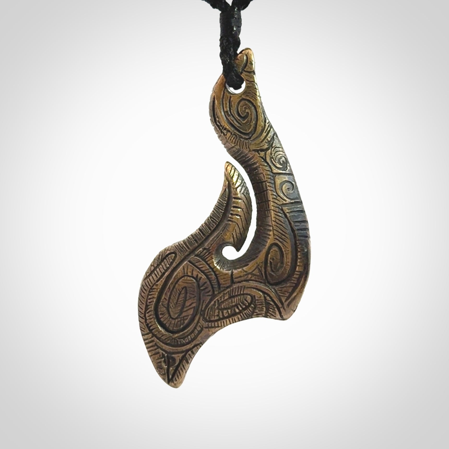 A beautiful hand made, bronze matau pendant.
