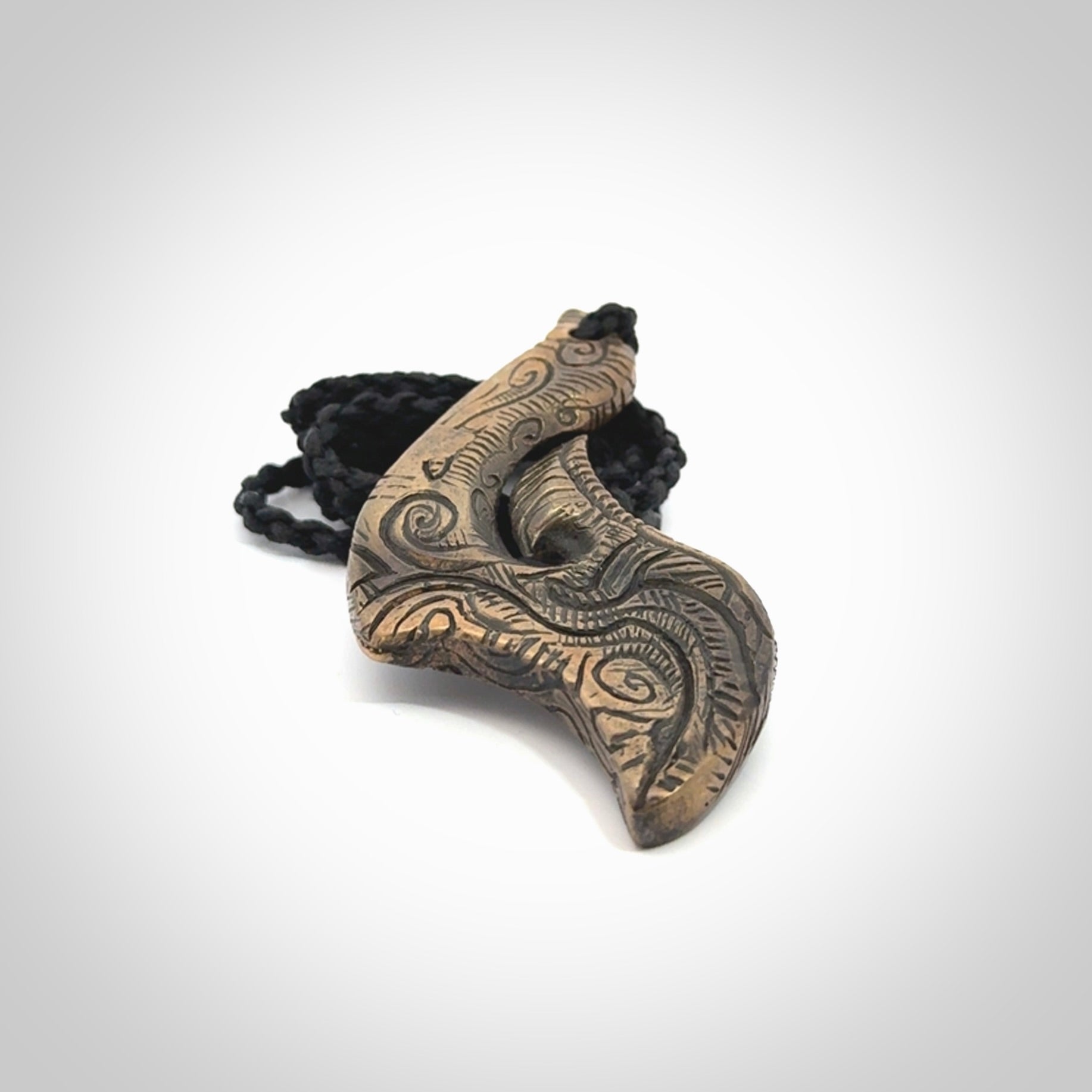 A beautiful hand made, bronze matau pendant.