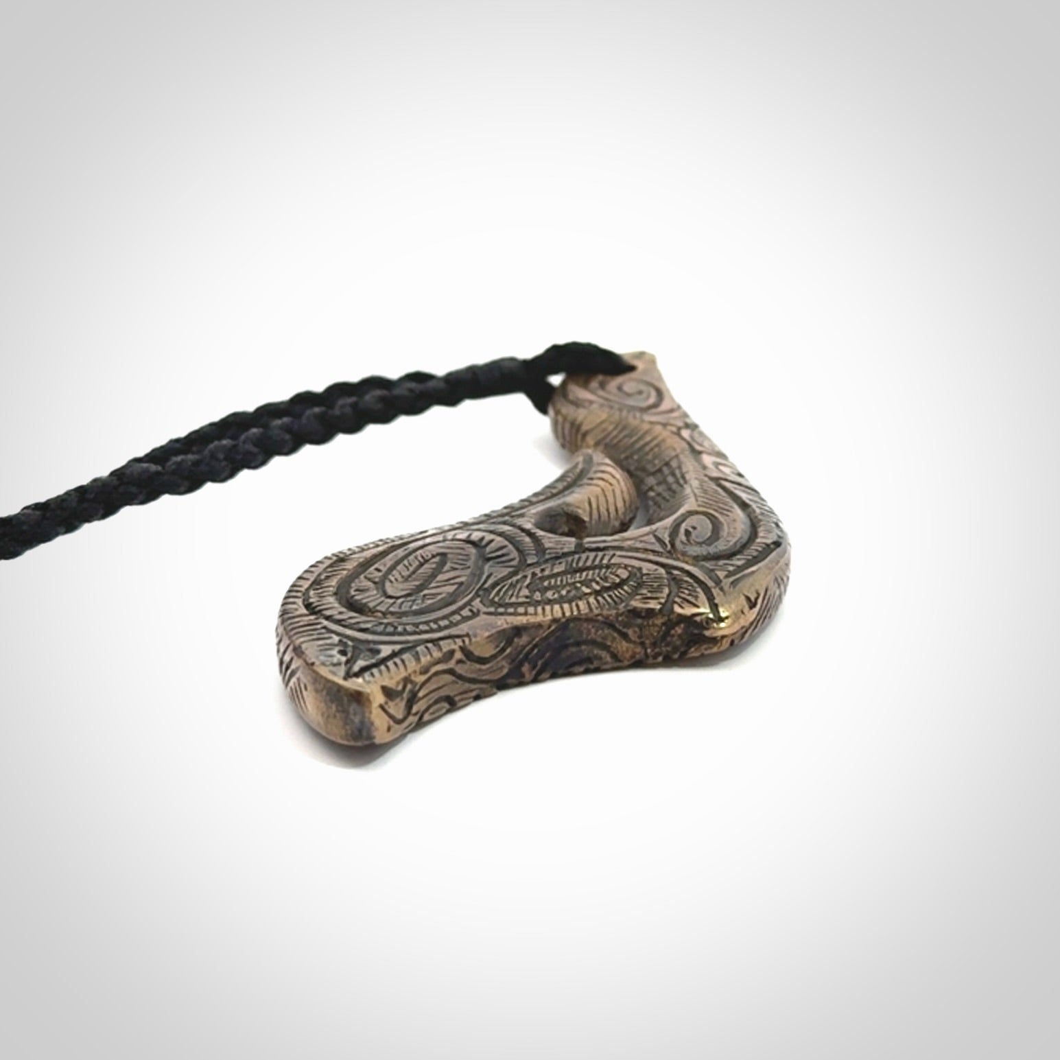 A beautiful hand made, bronze matau pendant.
