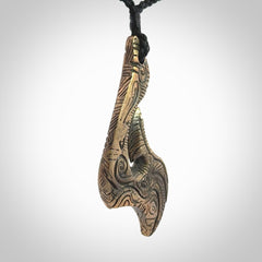 A beautiful hand made, bronze matau pendant.