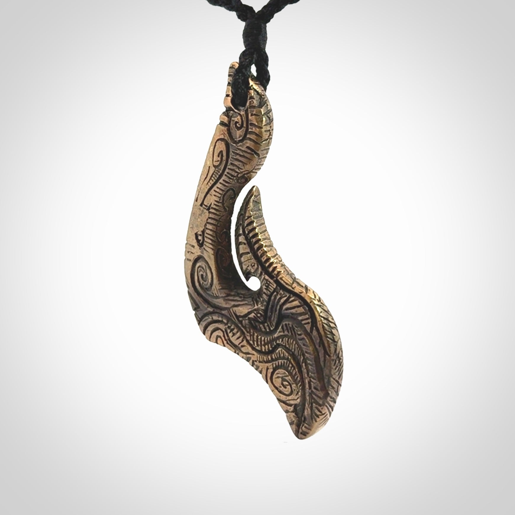A beautiful hand made, bronze matau pendant.