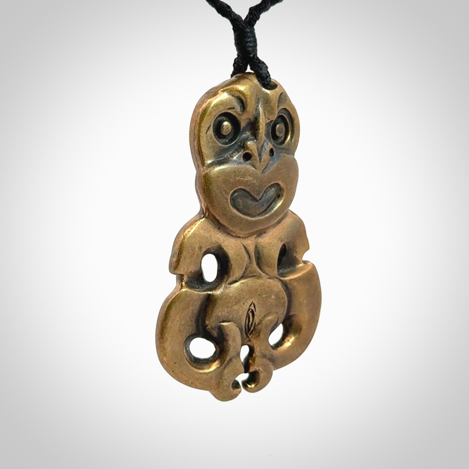 A beautiful hand made, bronze tiki pendant.