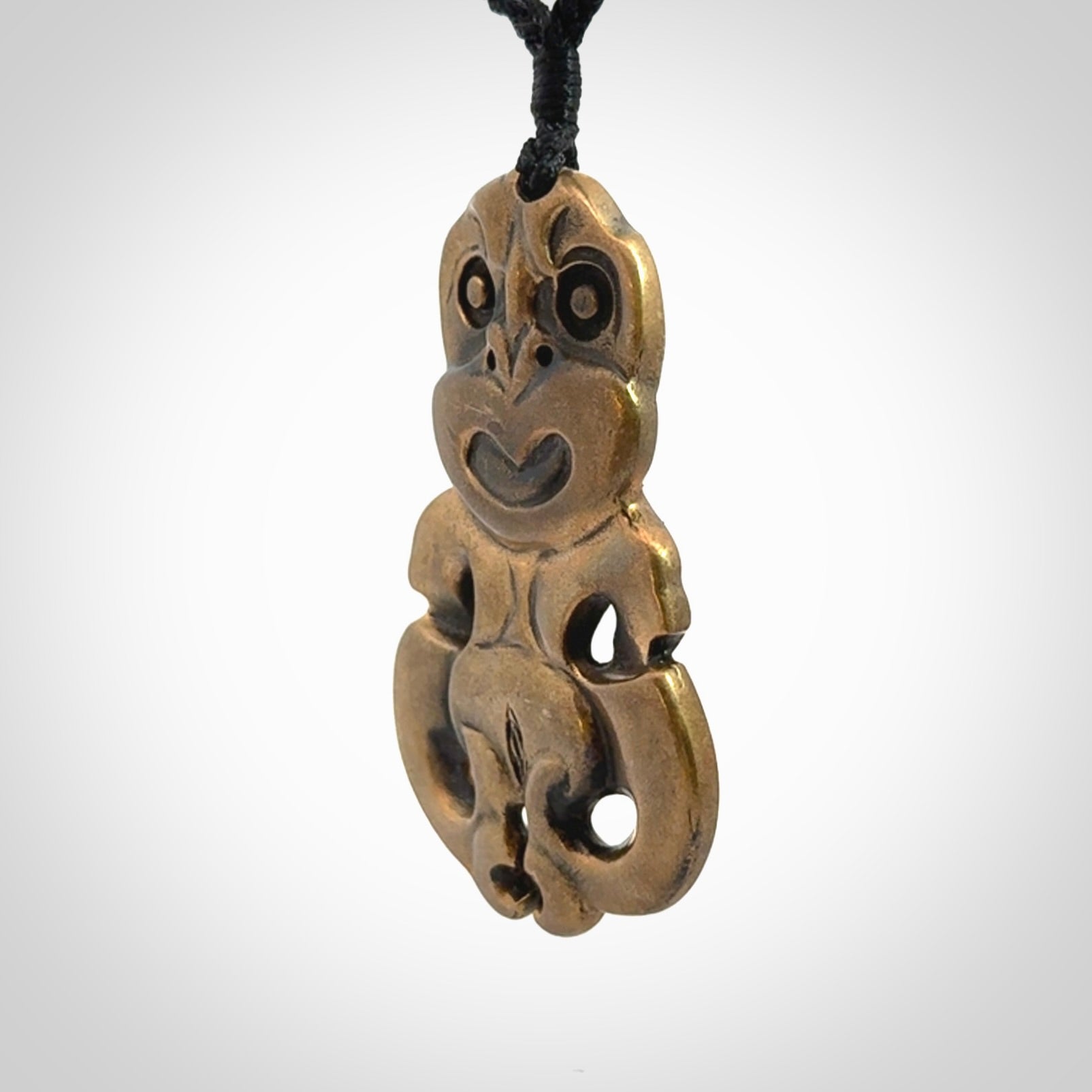 A beautiful hand made, bronze tiki pendant.